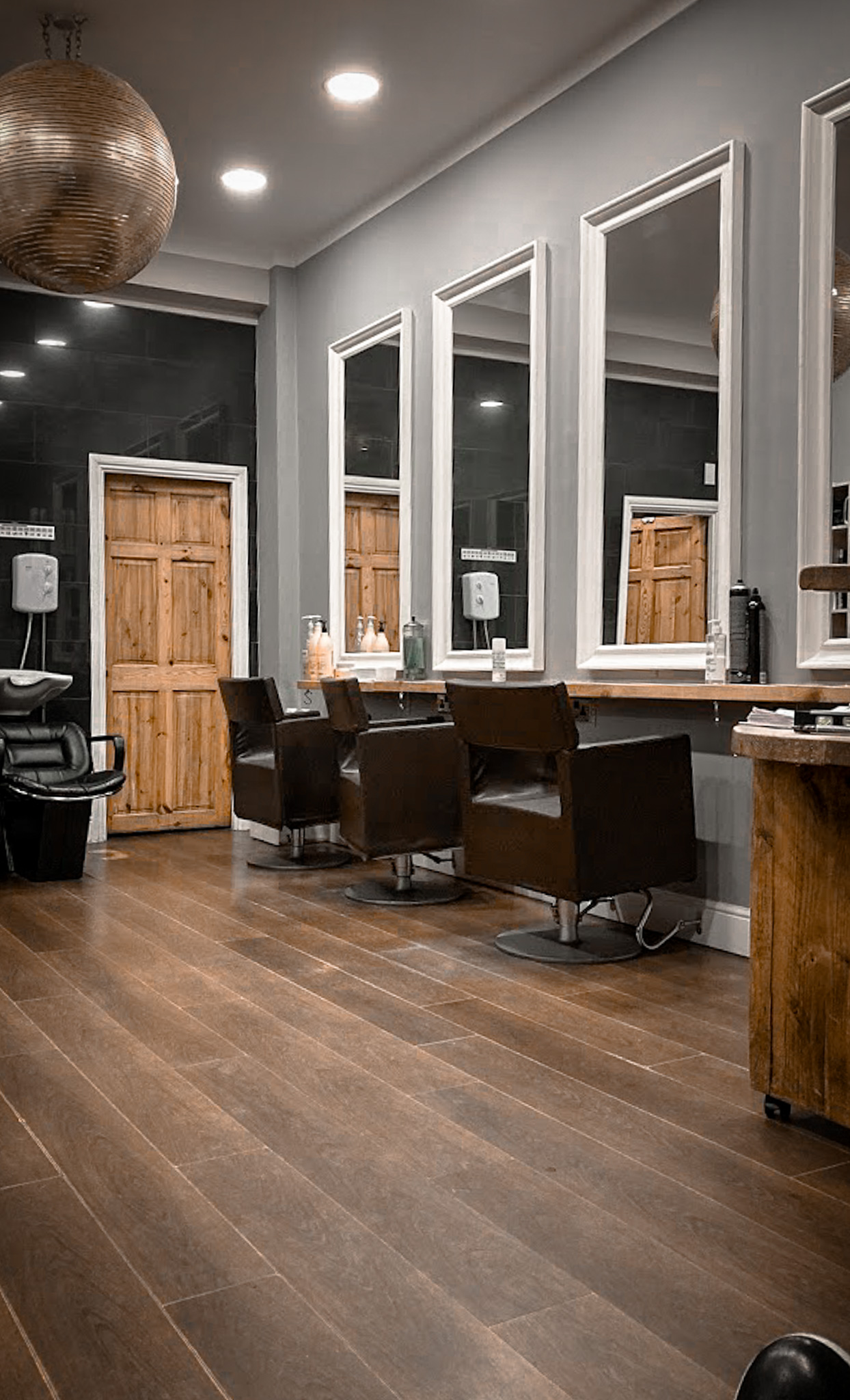 Salon interior with styling chairs and mirrors